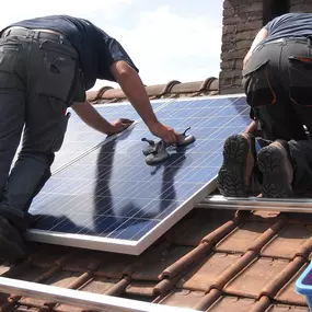 Roofing Contractors Installing Solar Panels on Roof