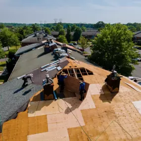 Aerial Shot of Contractors Repairing Roof