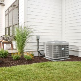 Newly Installed Carrier Air Conditioner Outside a Residential Home