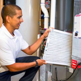 Replacing Furnace Filter During Routine Furnace Maintenance Service