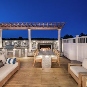 Outdoor living with built-in fireplace and grill