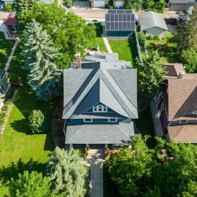 A beautiful and grand turn of the 20th century home in St. Paul.  This home was ravaged by hail and wind, so we replaced the entire roof with GAF HDZ Timberline Pewter Gray shingles.  The roof is steep with some slopes registering a 12/12 slope.  And the site conditions were challenging with limited