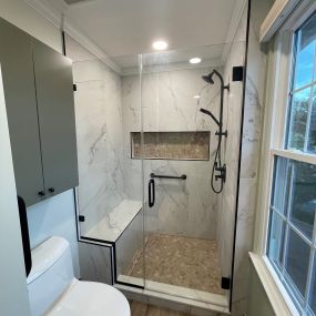 Custom shower with niche, bench, and handheld faucet