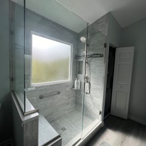 Primary bathroom remodel with custom shower, bench, porcelain tile