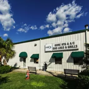 Located in Fayetteville, NC, Gore Heating & A/C, INC's storefront is inviting and well-kept. A prominent sign displays the company's name and logo. The interior features a welcoming reception area with comfortable seating. The exterior showcases the company's service vans, highlighting their commitment to providing reliable heating and cooling services in the Fayetteville area