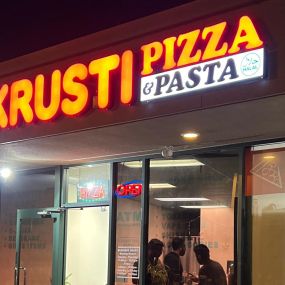Krusti Pizza and Pasta Storefront Signage, night, Santa Clara, California