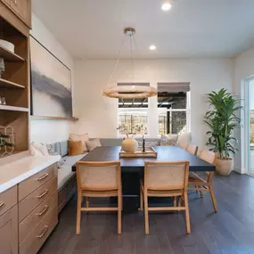 Casual dining spaces with access to private covered patio