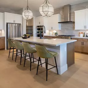 Stylish kitchens with oversized island and JennAir appliances