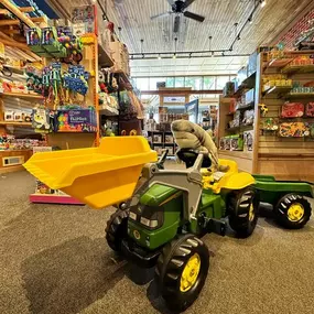 Our John Deere Kid Tractor With Trailer is still in stock! This outdoor mini tractor is an amazing summer toy for kids 3-7! Come test drive it today, it won’t be here for long! •