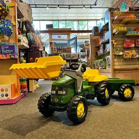 Our John Deere Kid Tractor With Trailer is still in stock! This outdoor mini tractor is an amazing summer toy for kids 3-7! Come test drive it today, it won’t be here for long! •