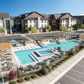 An aerial view of the apartment complex with a swimming pool