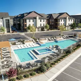 An aerial view of the apartment complex with a swimming pool