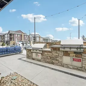 Outdoor kitchen with grilling stations