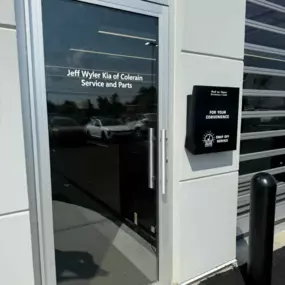 Exterior door of the Parts and Service Department at Jeff Wyler Kia of Colerain’s new facility, providing customer access to certified Kia service, auto repair, and genuine Kia OEM parts near Cincinnati.