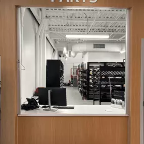 Parts Department desk at Jeff Wyler Kia of Colerain in Colerain, OH, where customers can order genuine Kia OEM parts, accessories, and replacement components with help from knowledgeable staff.