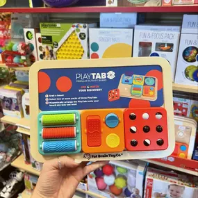 Introducing the ALL NEW PlayTab from Fat Brain!! 
Grab your PlayTab wooden activity board, plus two of your favorite Sensory Sets and you’re ready to go! This modular activity toy allows your littles to build a unique experience packed with fine motor challenges, visual fascination, cause-and-effect discoveries, plus much more!! Each tile is magnetic so you are able to perfectly build your board for you!! 
We’re so excited for PlayTab and we know you will love it too!! Come see it in person or c