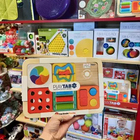 Introducing the ALL NEW PlayTab from Fat Brain!! 
Grab your PlayTab wooden activity board, plus two of your favorite Sensory Sets and you’re ready to go! This modular activity toy allows your littles to build a unique experience packed with fine motor challenges, visual fascination, cause-and-effect discoveries, plus much more!! Each tile is magnetic so you are able to perfectly build your board for you!! 
We’re so excited for PlayTab and we know you will love it too!! Come see it in person or c