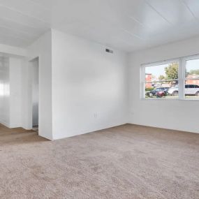 Large room with wide windows and access to the hallway at 5501 @ Norwood.