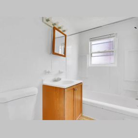 Bathroom with mirror, sink, and bathtub at 5501 @ Norwood.