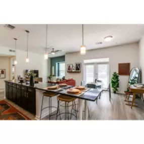 Kitchen View with bar top seating into the Dinning room Space