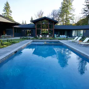 A stunning pool outside of a Ridgefield home that was constructed by Water's Edge Pools & Spas