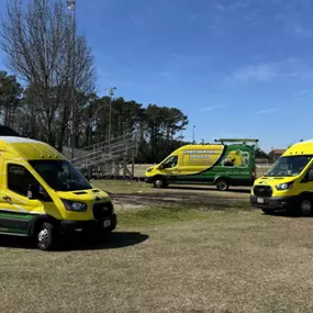 Coastal Home Services, Inc. - HVAC, Plumbing, and Electrical yellow work vans