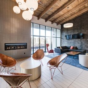 chairs and couches and a fireplace at Ashford Belmar Apartments, Colorado, 80226