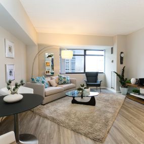 Living room  at The Apartments at Denver Place in Denver, CO 80202