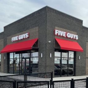 Exterior photograph of the Five Guys restaurant at 1312 N. Telegraph Road in Monroe, Michigan.