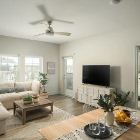 Open concept living room with hardwood flooring .