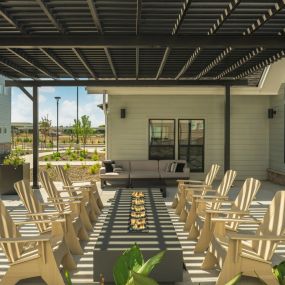 Outdoor poolside kitchen and communal seating.