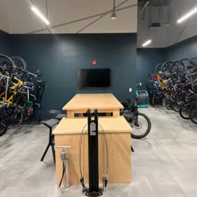 Bike storage room with fix it station and television