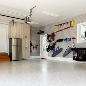 Is there anything better than a well-organized garage? We don't think so. This Lancaster family needed a space that did it all... and more. The custom workbench with lighting, pantry-style cabinets, abundant slatwall, and durable epoxy floor keeps them neat and stress-free!