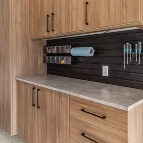 Get beautiful garage cabinets in Lancaster, PA by calling PremierGarage of Lancaster. We can help you add a workbench, bike storage, automated garage lifts, overhead storage, and interlocking tile or epoxy floor coating to any garage in Lancaster, PA!