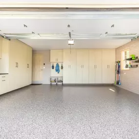 There's a place for everything in this Lancaster garage! A drop zone, storage lockers, custom workbench, wall storage and a durable epoxy floor complete this once lifeless, disorganized space.