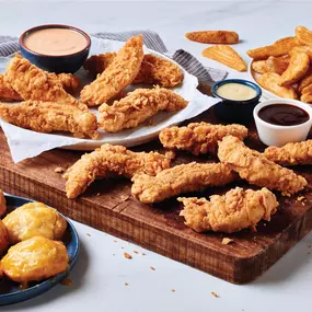 A full Southern-style meal with crispy fried chicken, seasoned wedges, and fluffy biscuits—perfect for sharing or satisfying your biggest cravings.