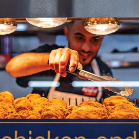 Hot and ready! Our team serves up fresh, crispy fried chicken straight from the case—perfect for a quick lunch or dinner on the go.