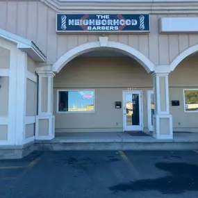 The Neighborhood Barbers logo and sign at new location