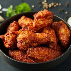 Oven roasted chicken wings hand-spun with your choice of Donatos wing sauce or dry rub.