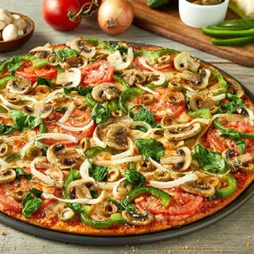 Freshly cut Roma tomatoes, green peppers and yellow onions, fresh mushrooms and baby spinach, green olives, smoked Provolone, Romano.
