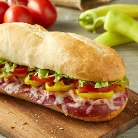 Oven baked with shaved ham, sliced salami, smoked Provolone, banana peppers, freshly cut Roma tomatoes, lettuce, and your choice of house Italian dressing or marinara sauce.