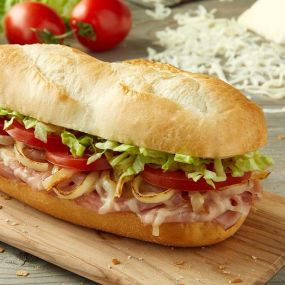 Oven baked with shaved ham, smoked Provolone, lettuce, freshly cut Roma tomatoes and yellow onions, house Italian dressing.