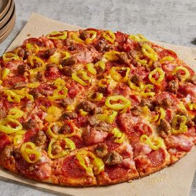 Family recipe pepperoni and sausage, shaved ham, banana peppers, smoked Provolone, Romano.