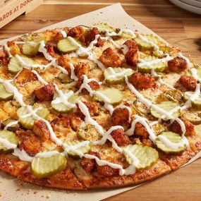 Crispy hot chicken, smoked Provolone cheese, jalapeño peppers, Romano, finished with dill pickles and a Ranch drizzle.