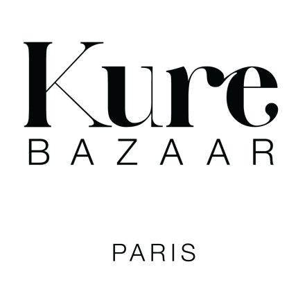 Logo from Kure Bazaar Nail & Brow Bar at Saks Fifth Avenue