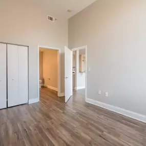 Bedroom with lofted ceiling at Crogman School Lofts