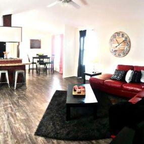 a living room filled with furniture and a large clock