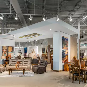 Comfortable showroom layout with recliners and dining furniture