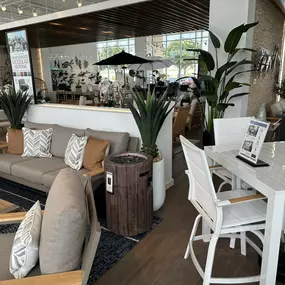 Cozy beige outdoor lounge set paired with a sleek white patio dining set.