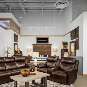 Traditional furniture display at Rooms To Go featuring rich brown tones.